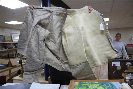 A late 19th century linen fencing jacket, with suede leather protect for body and arm for right handed fencer
